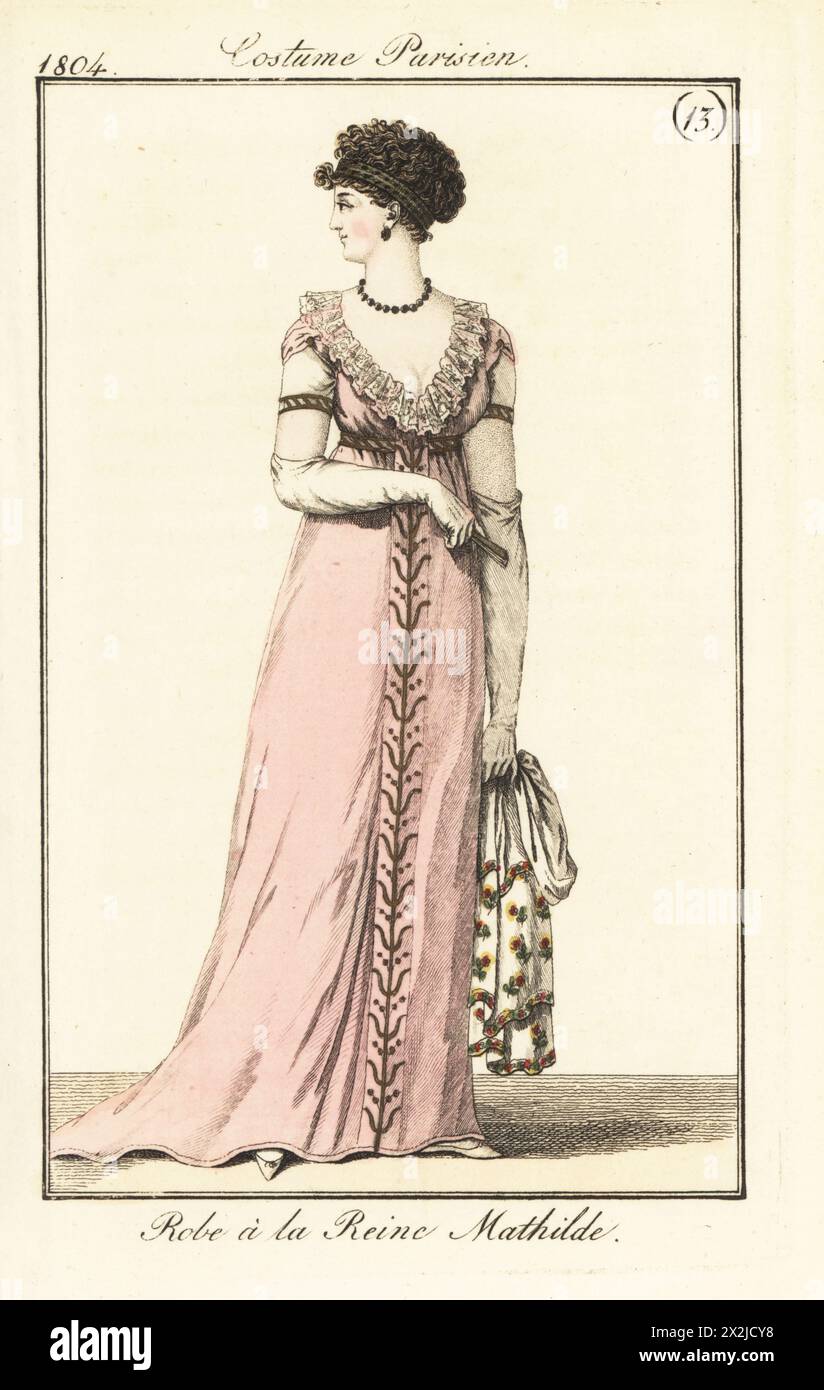 Donna con acconciatura intrecciata e abito basso nello stile della regina Matilde, ispirato a un costume nell'opera teatrale in un atto la Tapisserie de la Reine Mathilde, Vaudeville, 1804. Vesti a la Reine Mathilde. PL. 538 nell'edizione di Parigi. Incisione in rame colorato a mano dal Journal des Dames et des Modes di Pierre de la Messengere, Francfort sur le Mein (Francoforte) 1804. Dopo le illustrazioni di Carle Vernet, Jean-Francois Bosio, Dominique Bosio e Philibert Louis Debucourt. Foto Stock