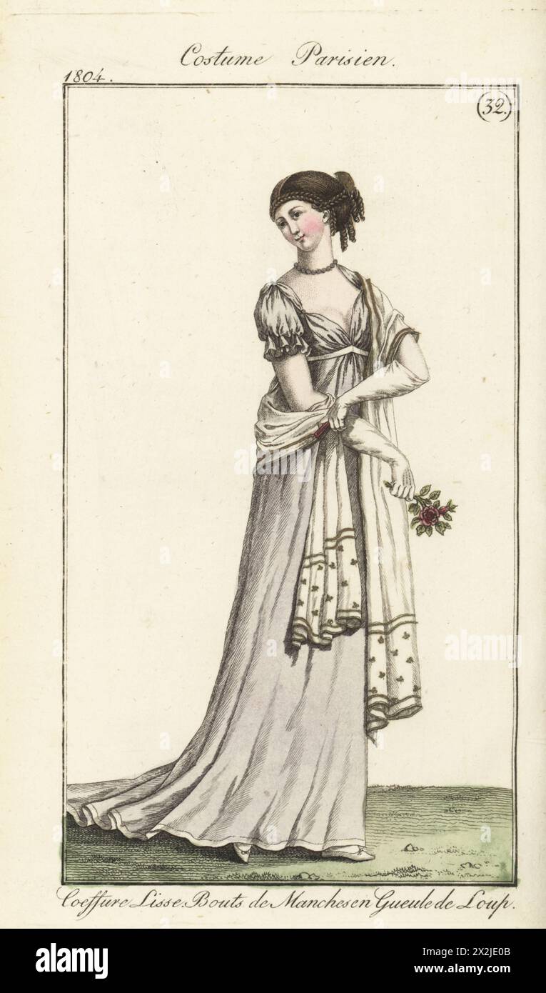 Donna con capelli in trecce e ricci, abito in seta viola, maniche corte con polsini a scialle ricamate. Coeffure lisse, Robe de soie viola, bouts de manches en gueule de Loup. PL. 568 nell'edizione di Parigi. Incisione in rame colorato a mano dal Journal des Dames et des Modes di Pierre de la Messengere, Francfort sur le Mein (Francoforte) 1804. Dopo le illustrazioni di Carle Vernet, Jean-Francois Bosio, Dominique Bosio e Philibert Louis Debucourt. Foto Stock