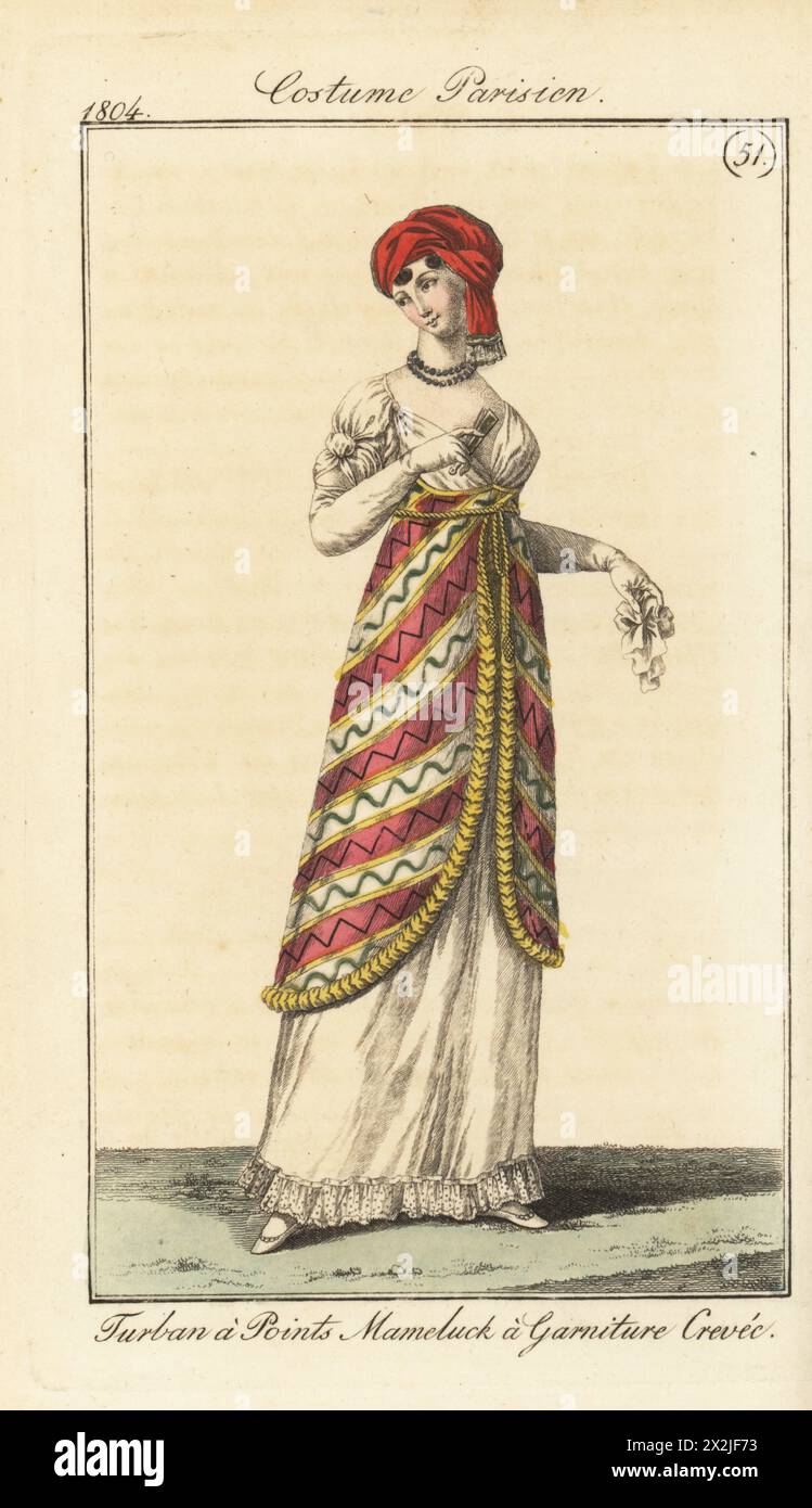 Donna francese in turbante con estremità in raso, tunica mamelucca con finitura oro, abito in muschio bianco con orlo in pizzo. Turbare un pointes en satin, Mameluck un crepaccio di mobili. PL. 596 nell'edizione di Parigi. Incisione in rame colorato a mano dal Journal des Dames et des Modes di Pierre de la Messengere, Francfort sur le Mein (Francoforte) 1804. Dopo le illustrazioni di Carle Vernet, Jean-Francois Bosio, Dominique Bosio e Philibert Louis Debucourt. Foto Stock