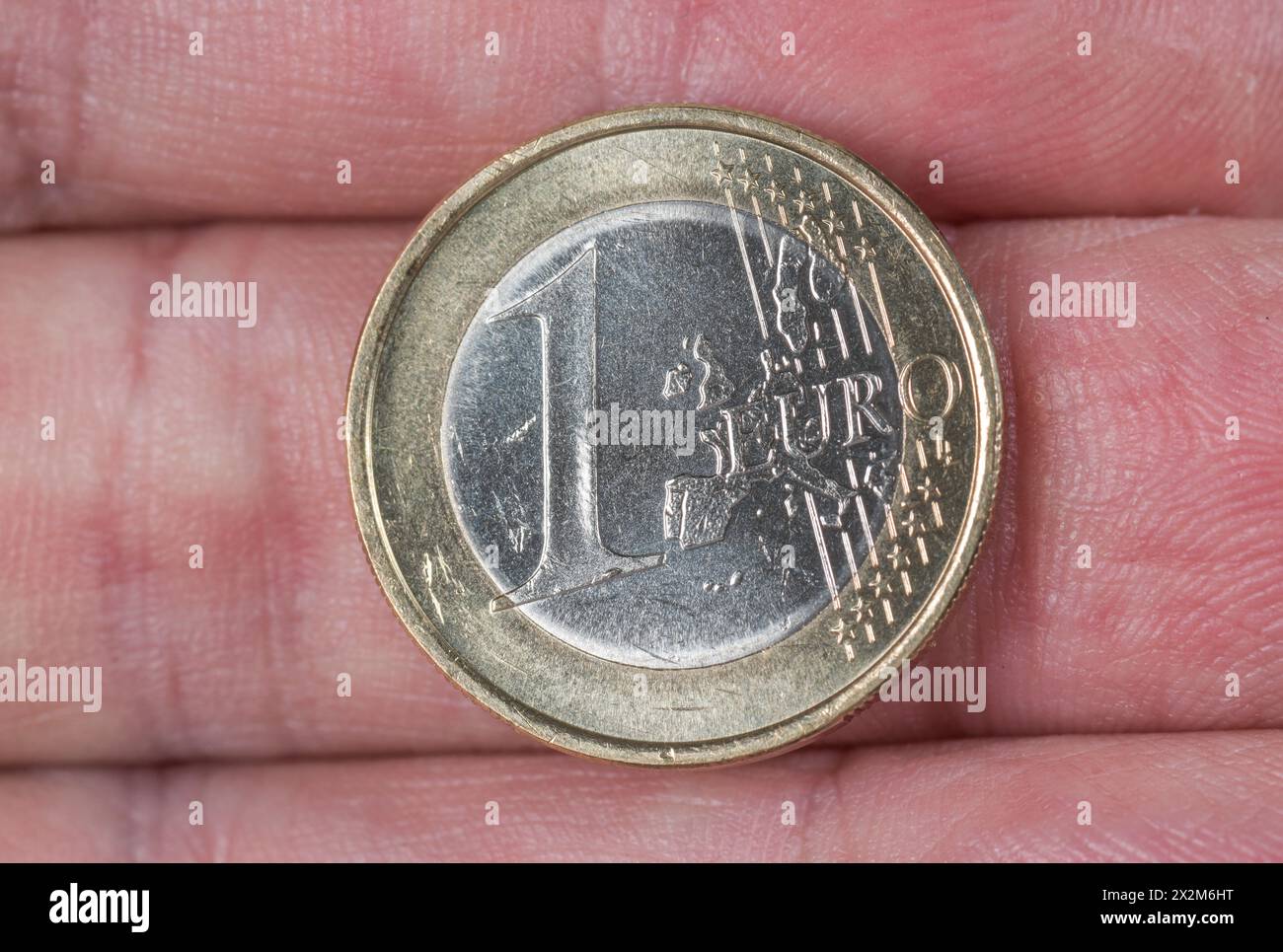 Geld, Hand, Münze, 1 Euro, Symbolfoto Foto Stock