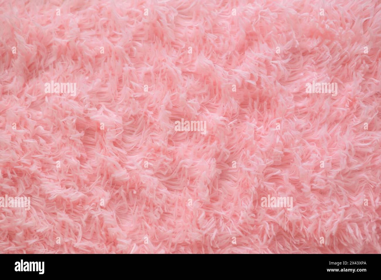 Primo piano: Texture in pelliccia rosa o tappeto per lo sfondo. Foto di alta qualità Foto Stock