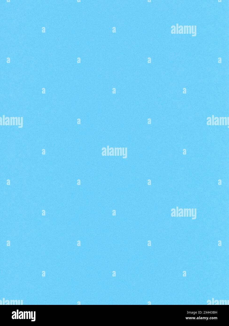 Grana di carta colorata, superficie di un foglio di carta azzurro Foto Stock