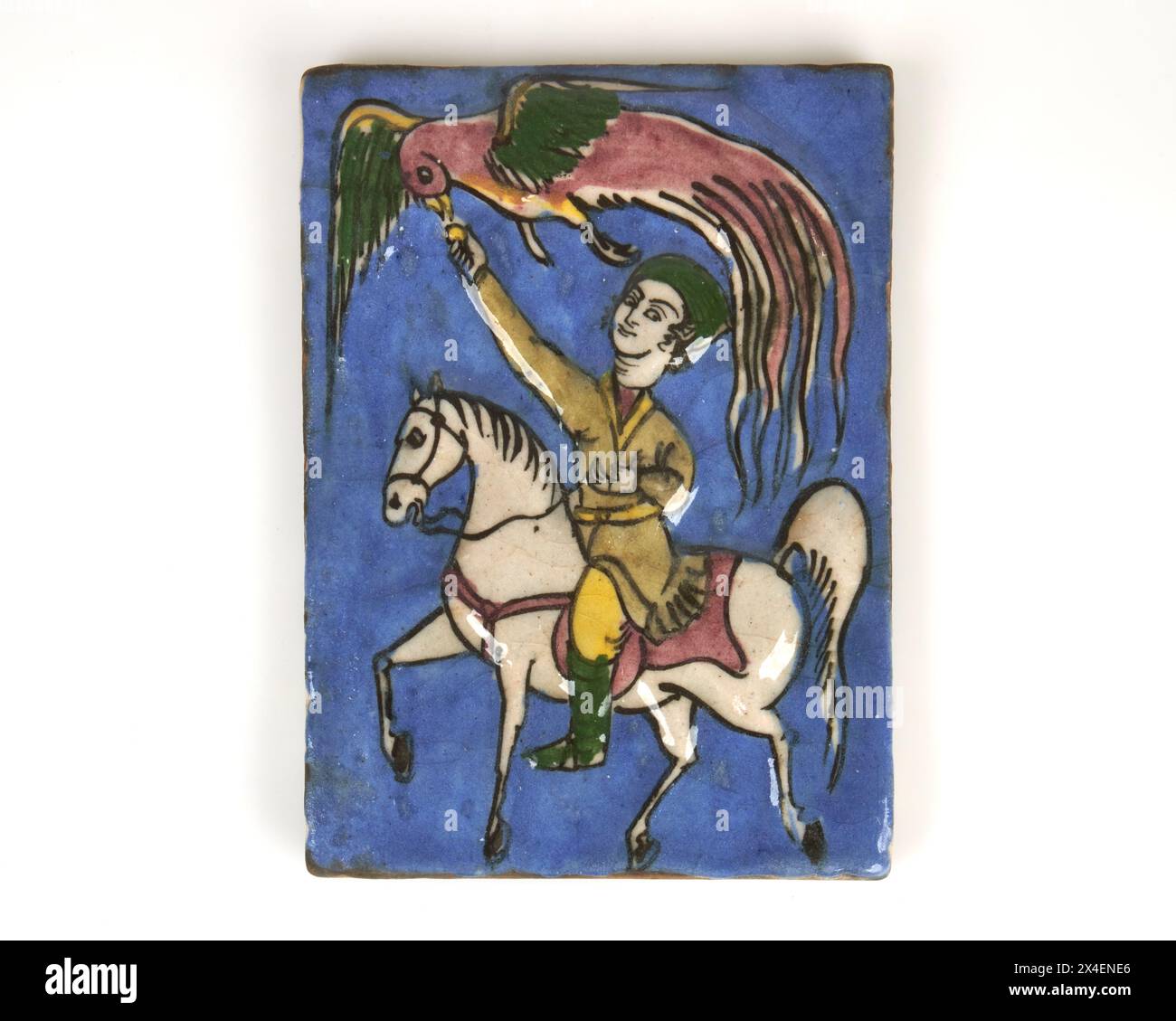 Antica piastrella persiana Qajar degli anni '1900 in ceramica di falconeria con stampa a mano. Foto Stock