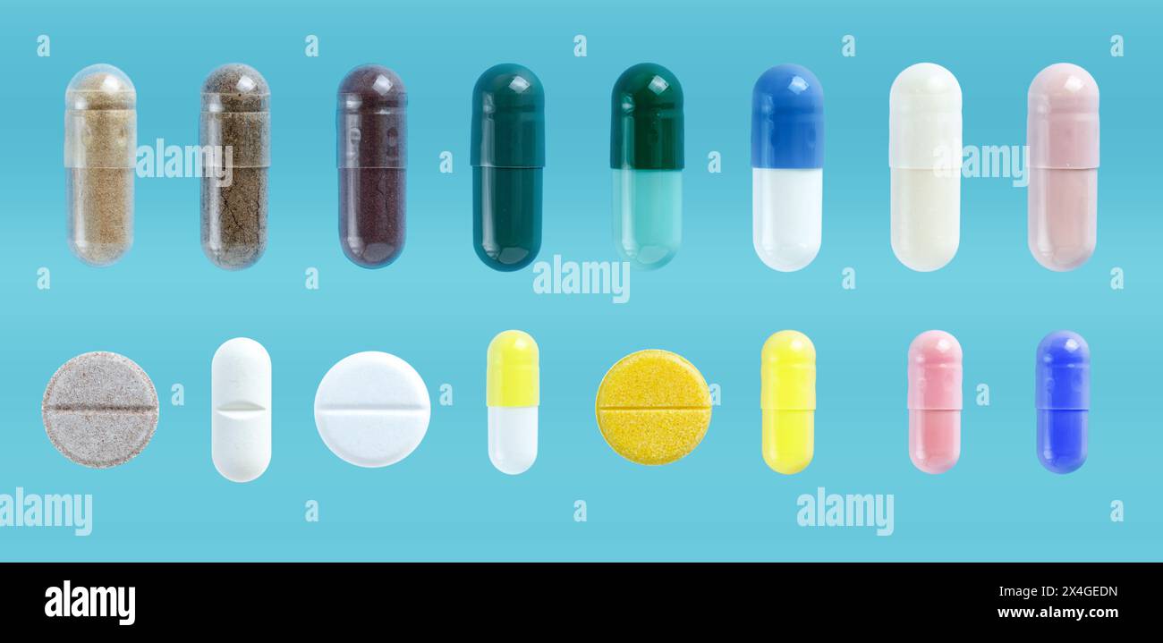 Pillole mediche e capsule set, su sfondo blu. Farmaci antidolorifici farmaceutici. Foto Stock