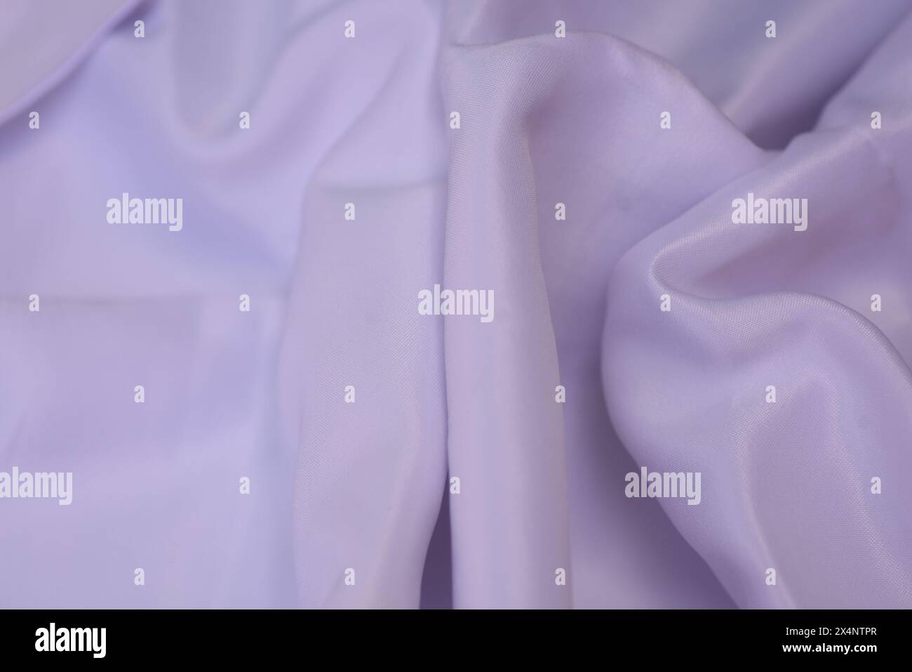 Un tessuto bianco liscio luminoso con una texture dettagliata Foto Stock