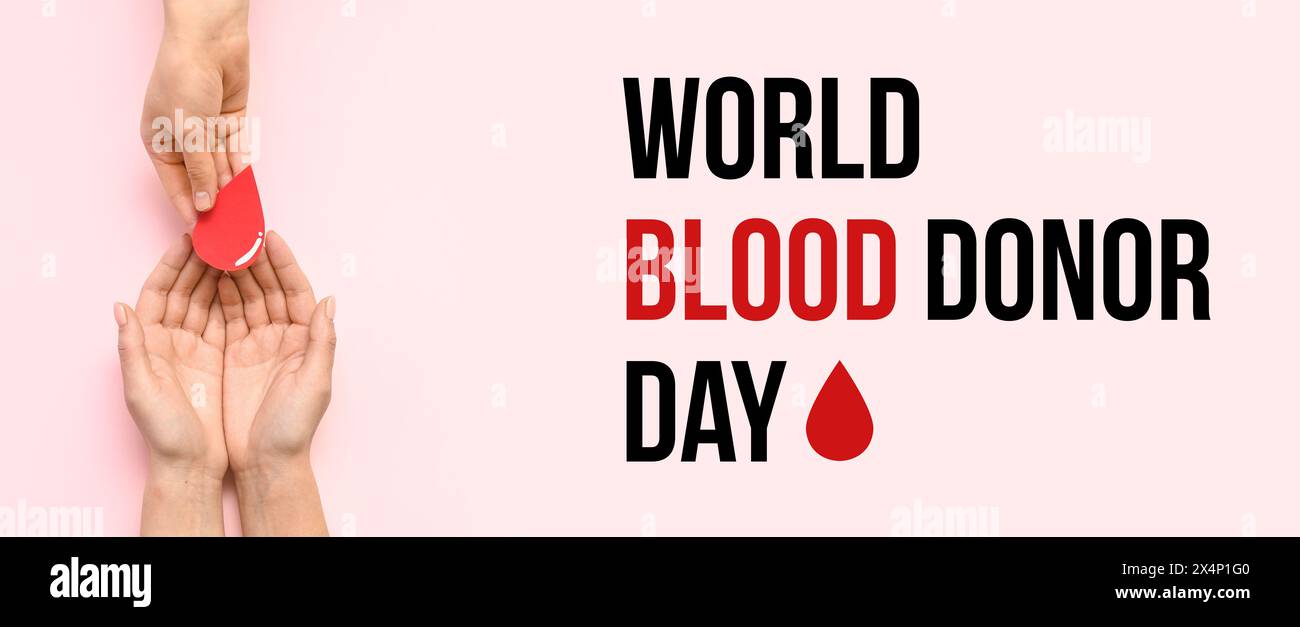Striscione per la giornata mondiale dei donatori di sangue con mani e gocce di sangue di carta Foto Stock