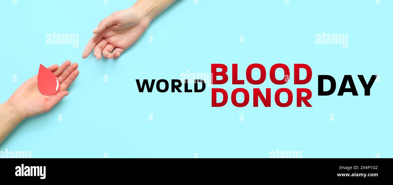 Striscione per la giornata mondiale dei donatori di sangue con mani e gocce di sangue di carta Foto Stock