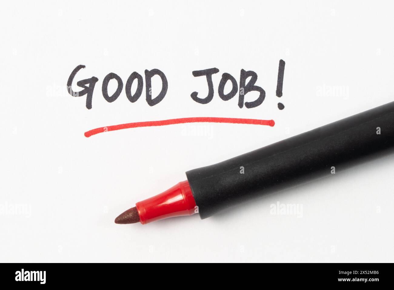 Scrittura a mano buona parola di lavoro o testo con pennarello rosso isolato su sfondo bianco Foto Stock