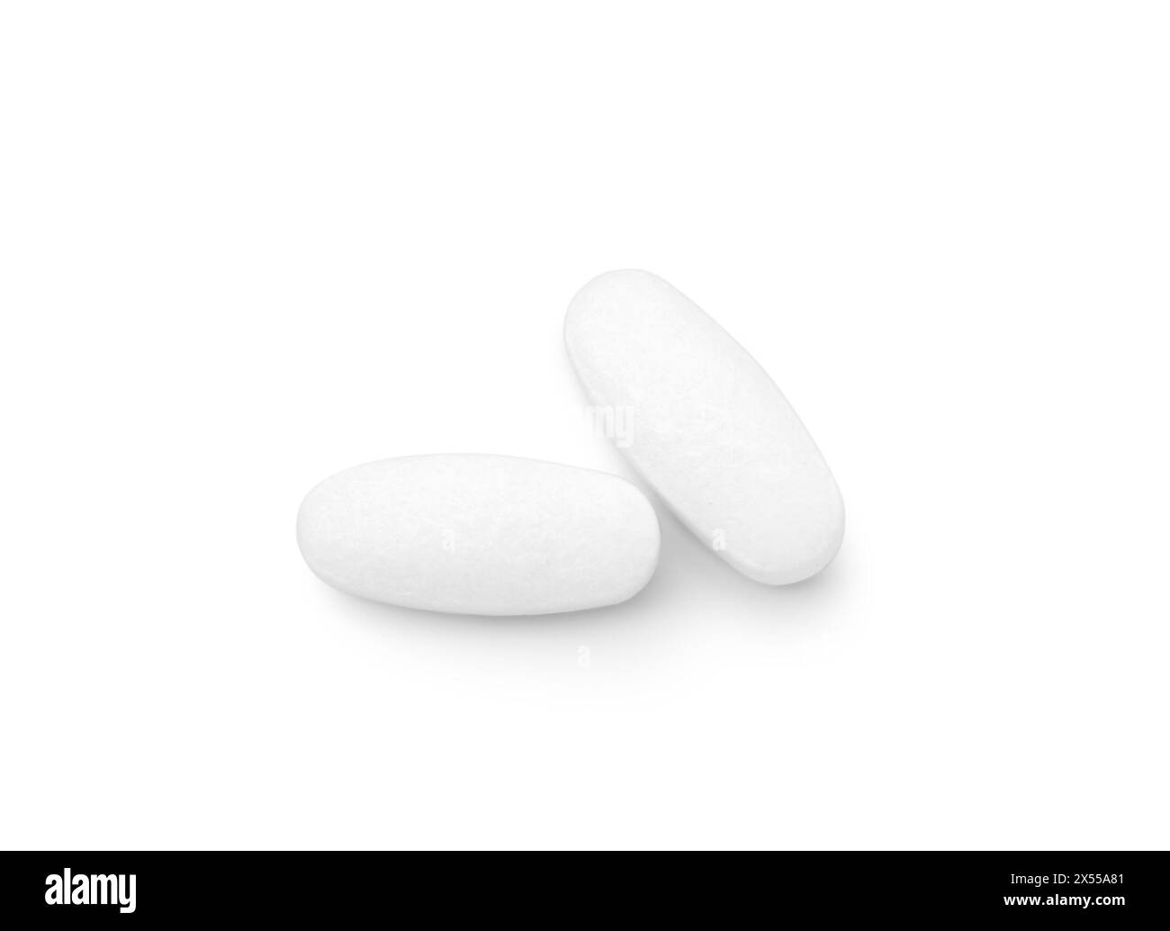 Pillole vitaminiche isolate su bianco, vista dall'alto. Supplemento di salute Foto Stock