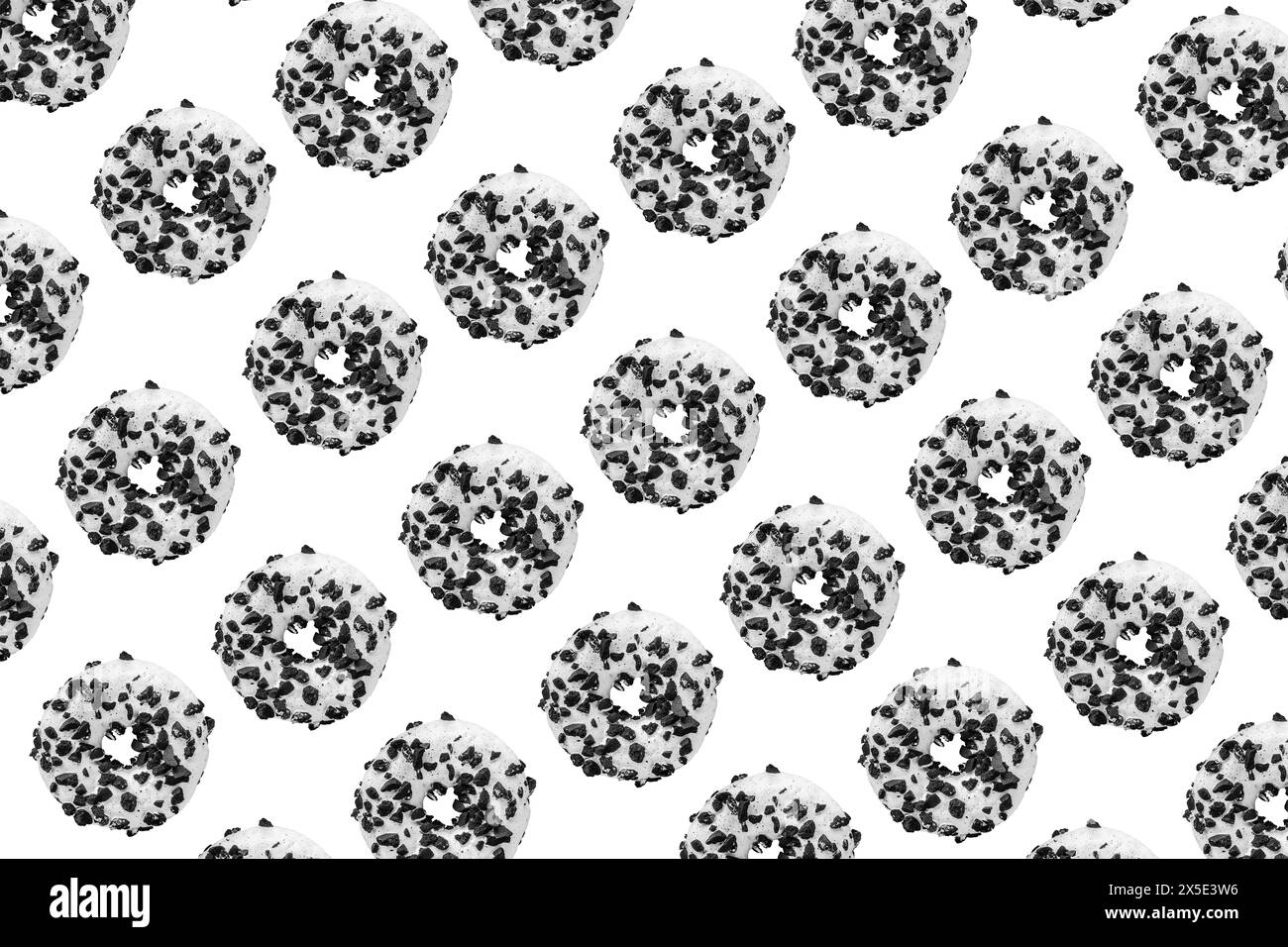 Motivo realizzato con ciambella bianca e nera su sfondo bianco Foto Stock