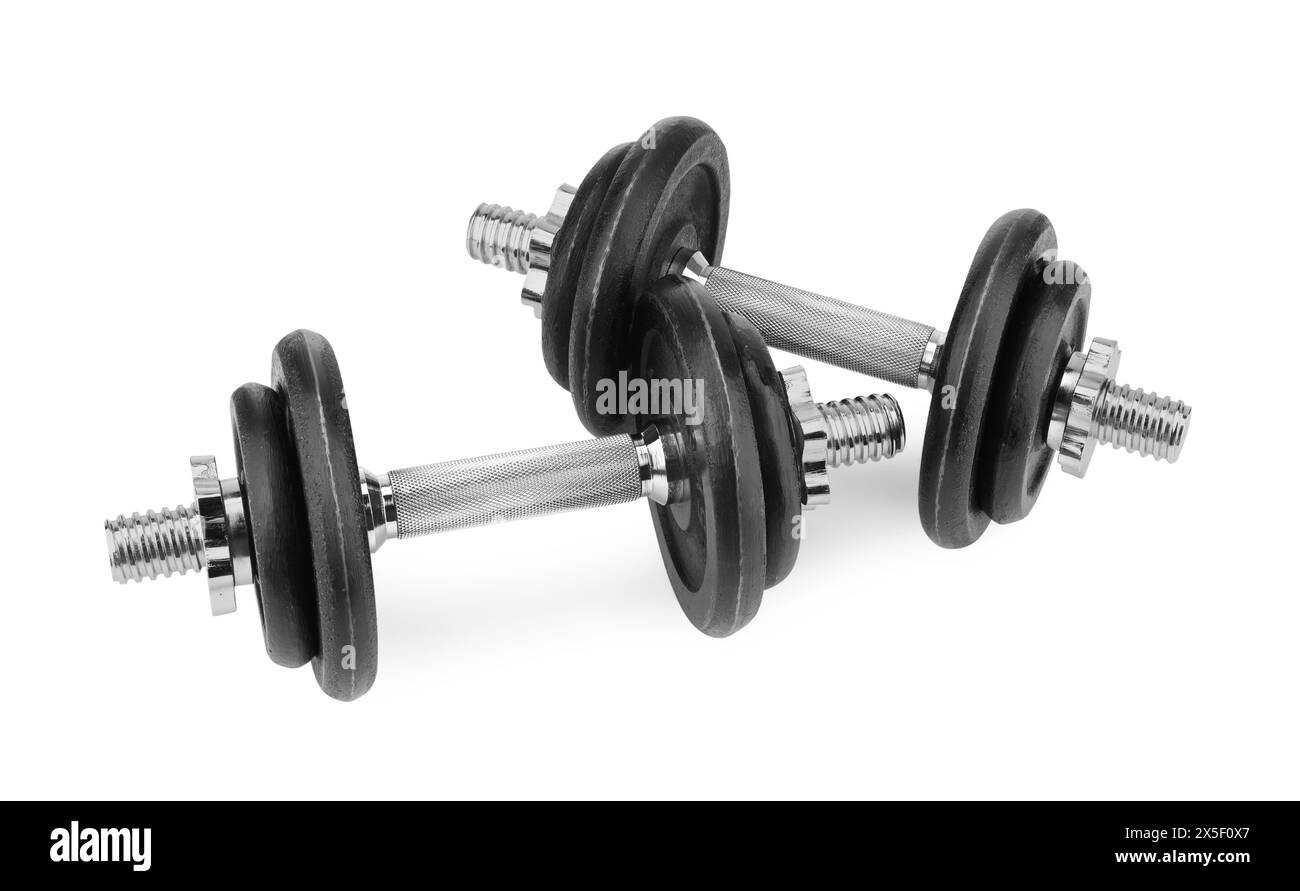 Manubri in metallo isolati su bianco. Attrezzature sportive Foto Stock