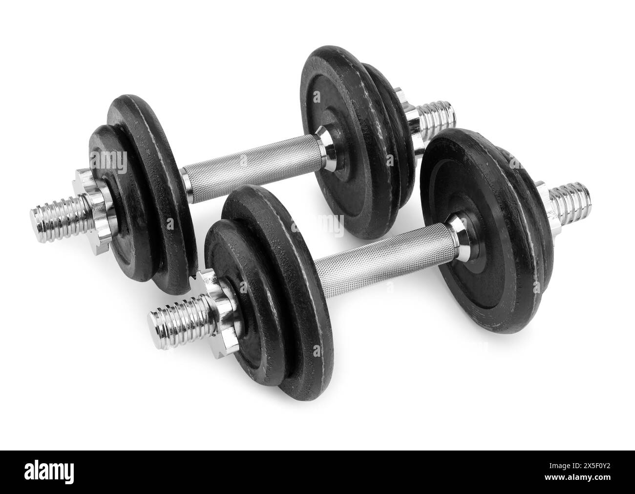 Manubri in metallo isolati su bianco. Attrezzature sportive Foto Stock