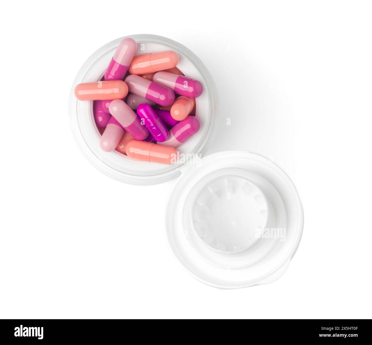 Vista dall'alto del flacone di pillole colorate su sfondo bianco Foto Stock