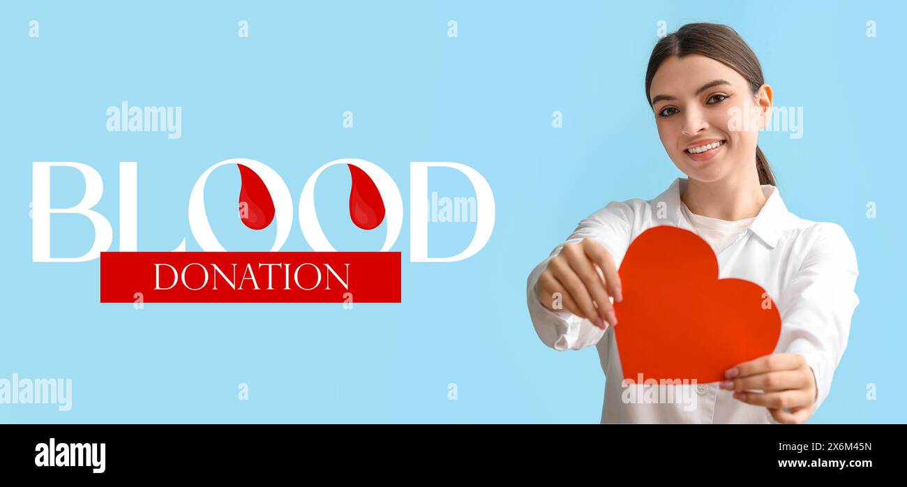 Striscione per la giornata mondiale dei donatori di sangue con una giovane dottoressa che tiene il cuore di carta Foto Stock