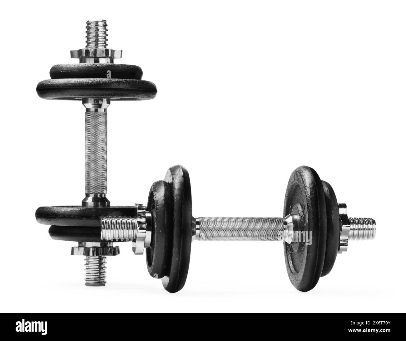 Manubri in metallo isolati su bianco. Attrezzature sportive Foto Stock
