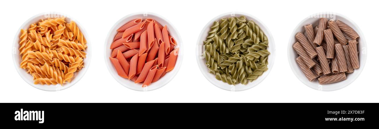 Varianti di pasta senza glutine in ciotole bianche. Spaghetti senza farina di grano. Fusilli di ceci, penne di lenticchie rosse, fusilli di pisello verde e tortiglion di grano saraceno Foto Stock