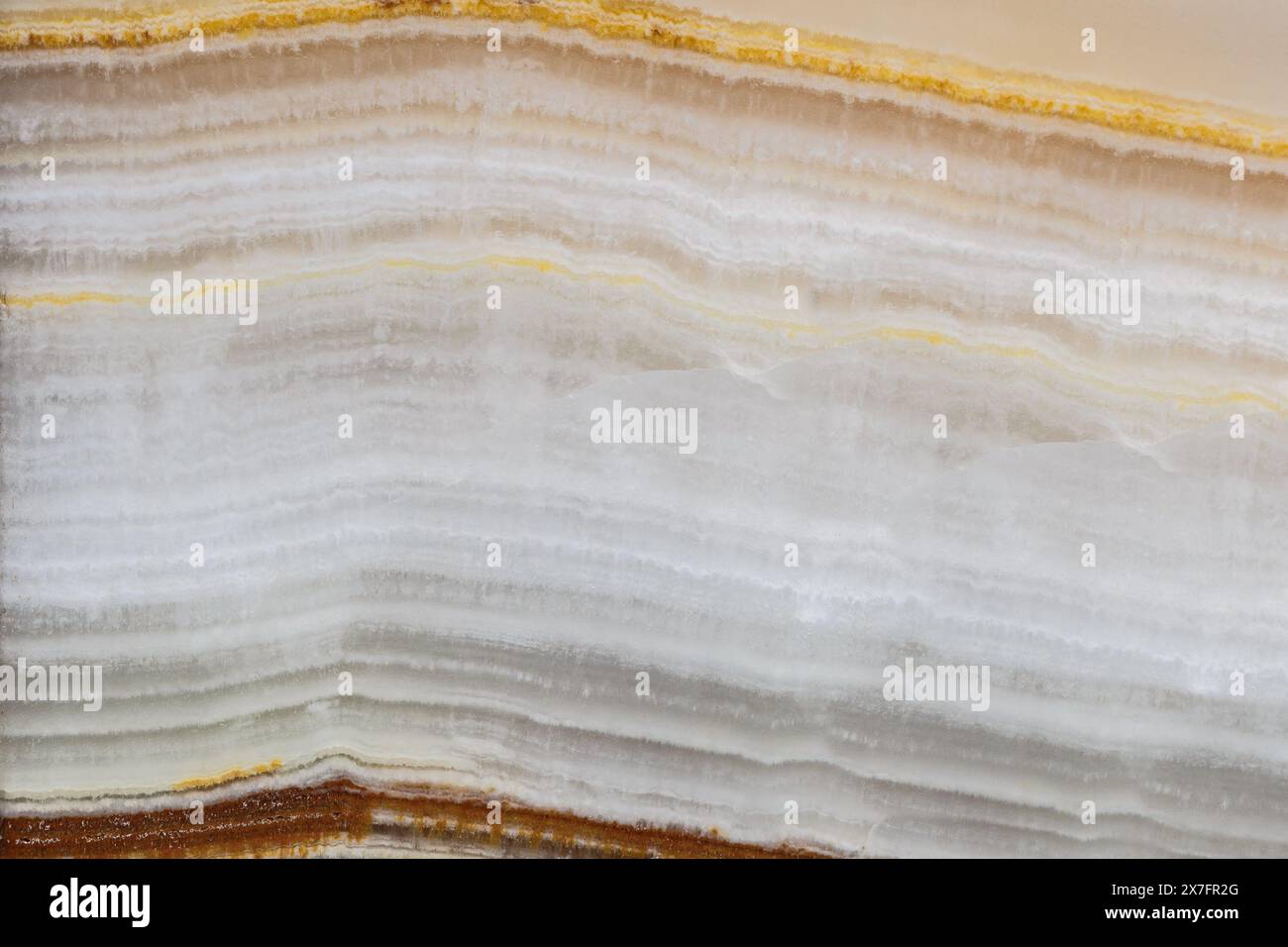 La texture di un primo piano in pietra semi-preziosa a strati. Sfondo naturale astratto Foto Stock