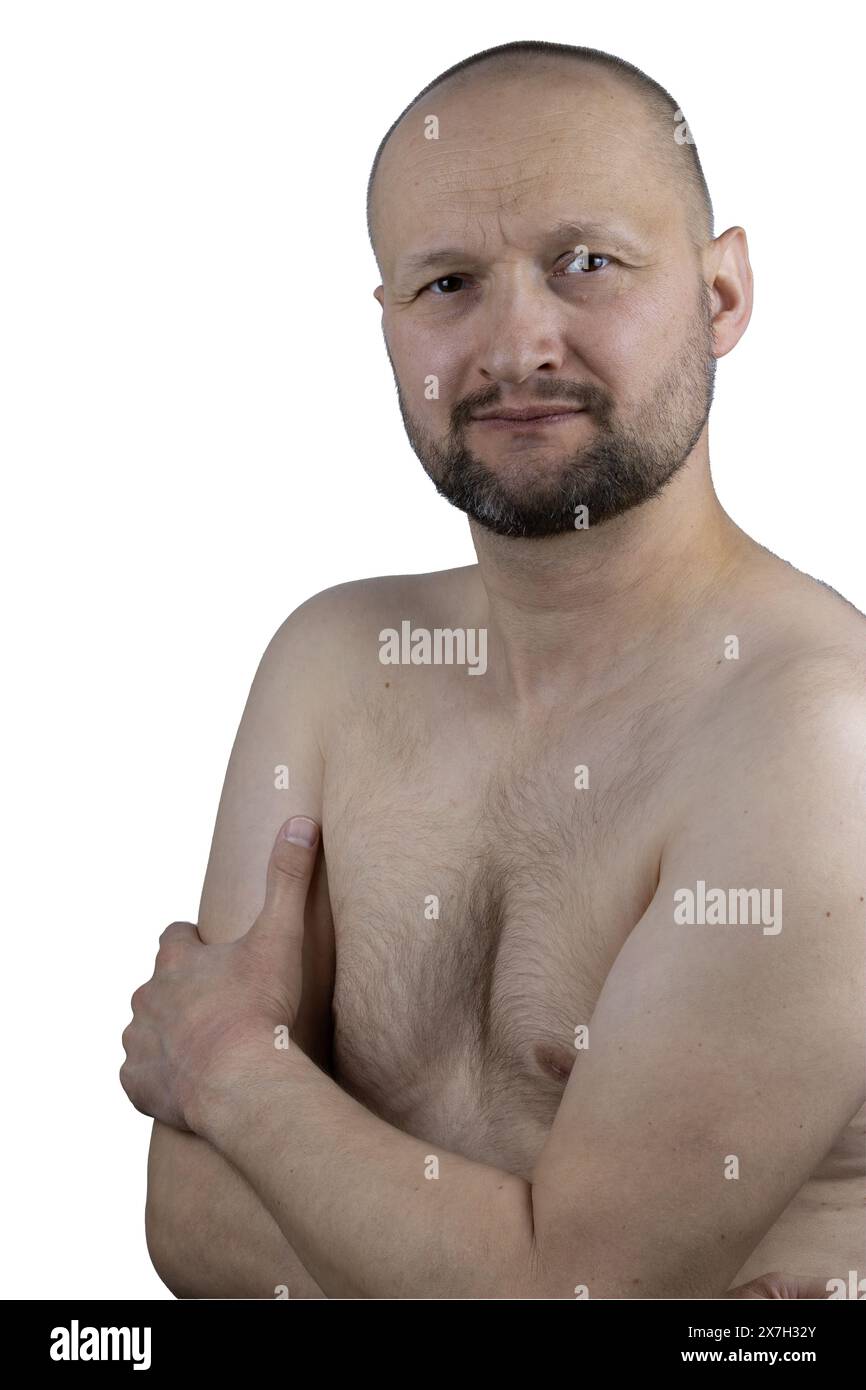 Questo coinvolgente ritratto cattura le emozioni grezze di un uomo di 45 anni che si trova ad affrontare l'intenso dolore muscolare associato alla fibromialgia. Foto Stock