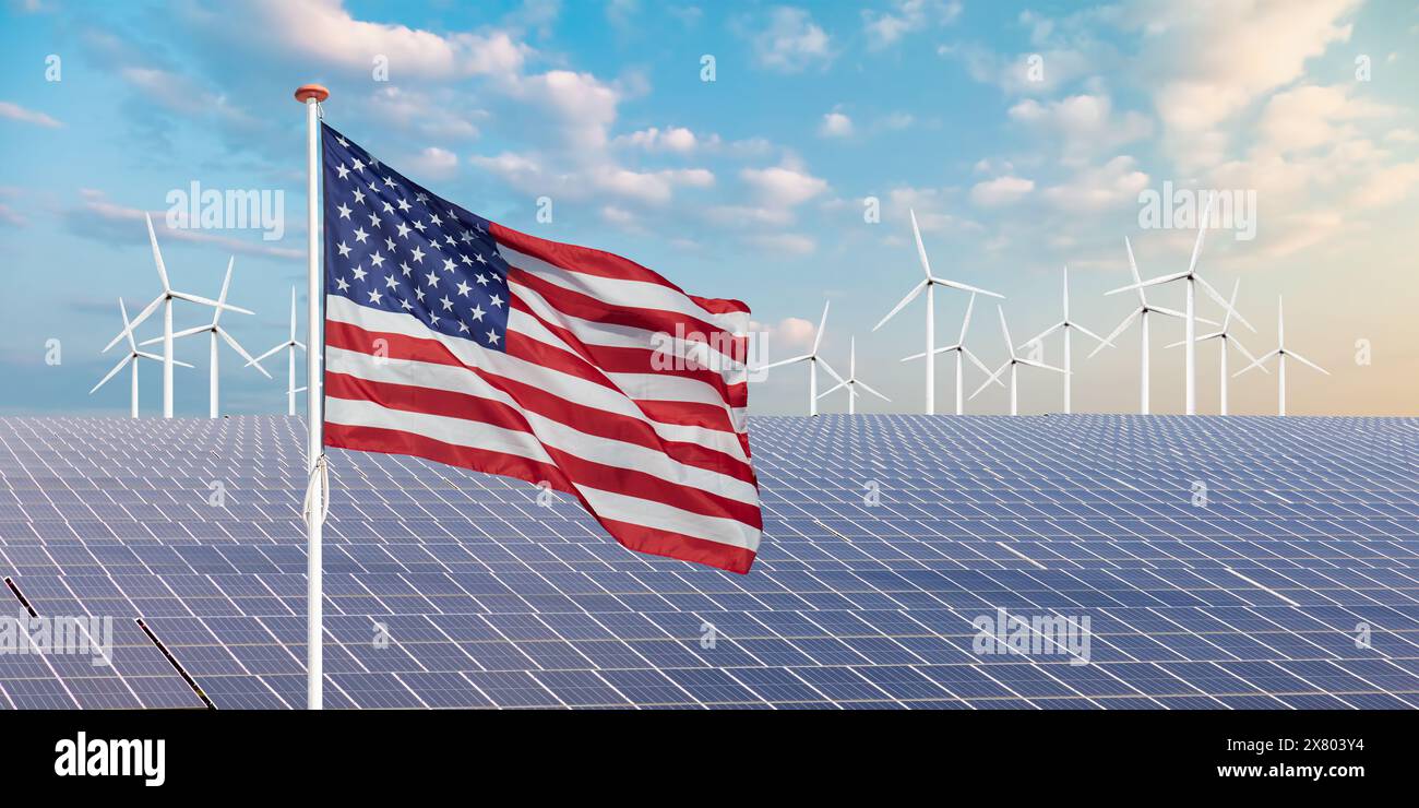Bandiera ufficiale degli Stati Uniti di fronte a una vasta gamma di pannelli solari e turbine eoliche Foto Stock