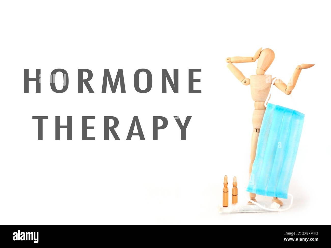 Un uomo sta tenendo un panno blu sulla faccia. L'immagine è intitolata terapia ormonale Foto Stock