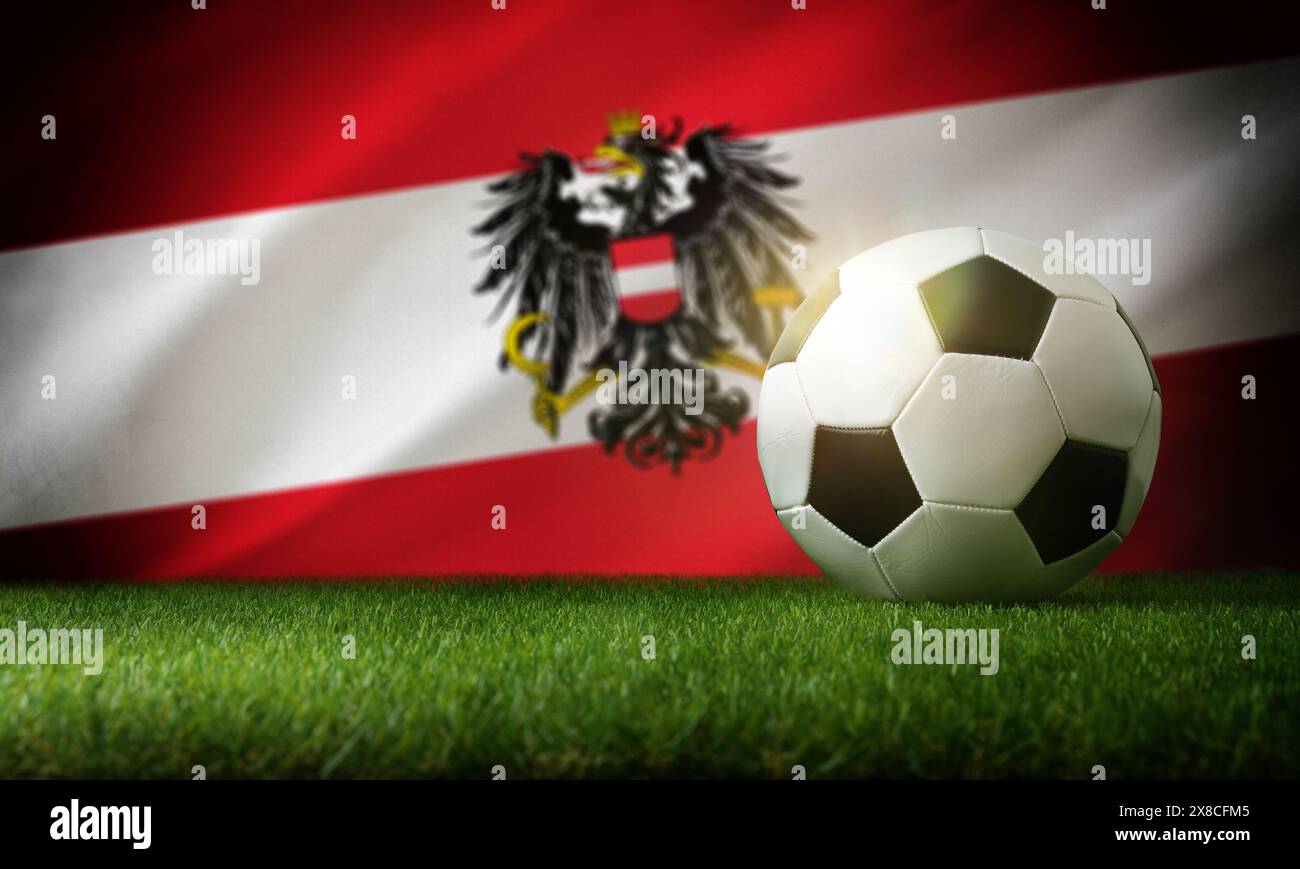 Composizione della nazionale austriaca con palla classica su erba e bandiera sullo sfondo. Vista dall'alto. Foto Stock