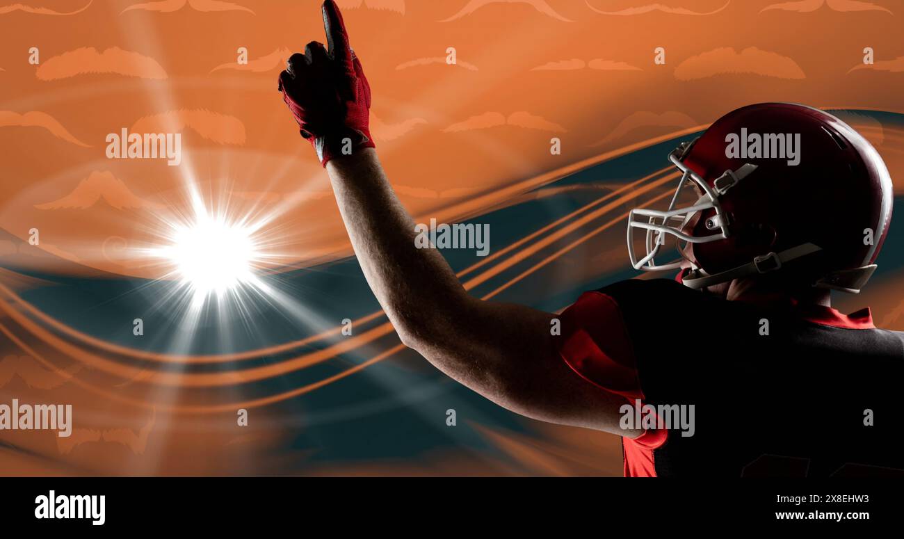 Immagine di tattiche di gioco con freccia e simboli sopra un giocatore di rugby maschile che punta il dito verso il cielo Foto Stock