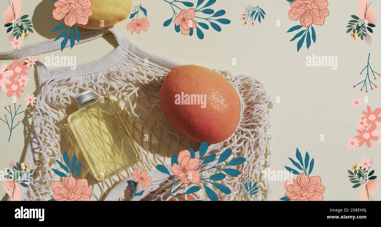 Immagine di una cornice di fiori con bottiglia, arancio nel sacchetto e spazio di copia su sfondo bianco Foto Stock