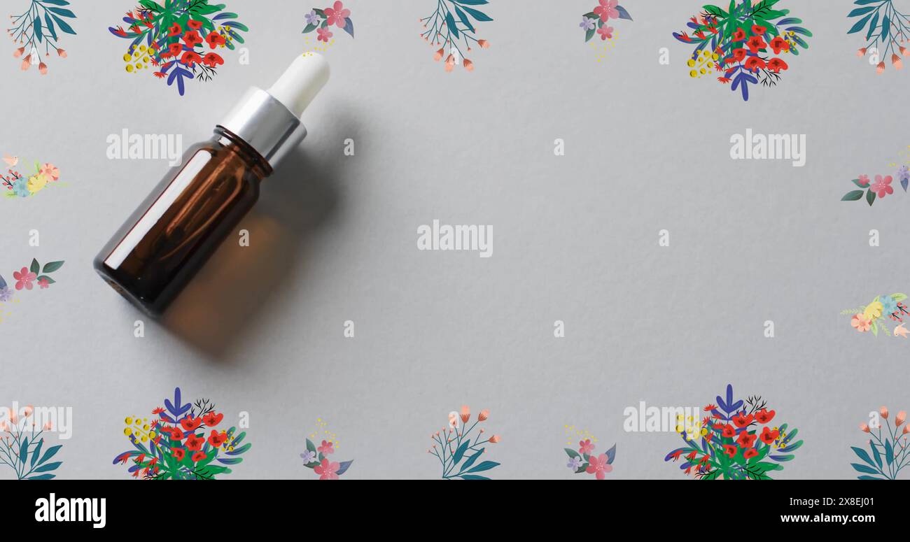 Immagine di una cornice di fiori con bottiglia marrone e copia dello spazio su sfondo bianco Foto Stock