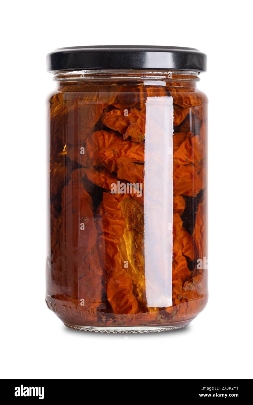 Pomodori secchi in olio di girasole, antipasto in vaso di vetro con tappo a vite. Pomodori interi, essiccati all'aria sotto il sole italiano, marinati e conservati. Foto Stock