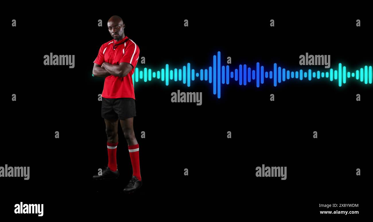 Immagine di un atleta afroamericano maschile con braccia in piedi incrociate sopra un'onda sonora su sfondo nero Foto Stock