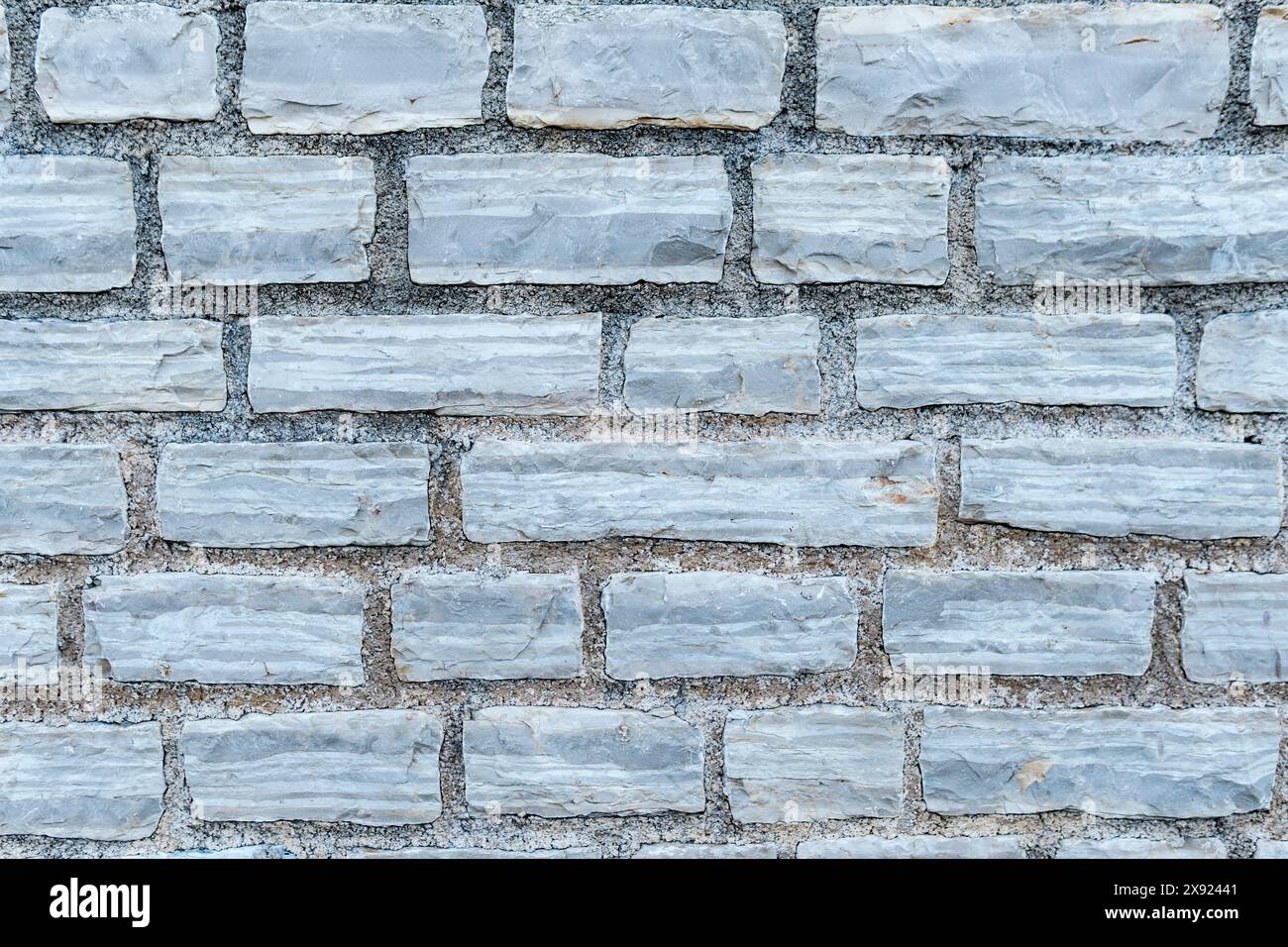 Struttura di un vecchio muro in pietra Foto Stock