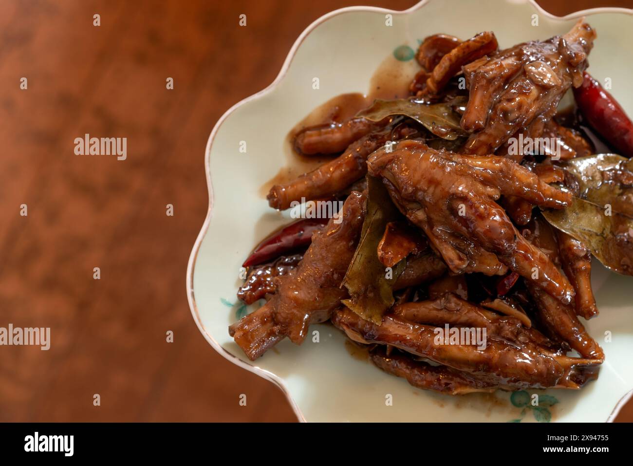 Pollo ai piedi adobo - un piatto filippino Foto Stock