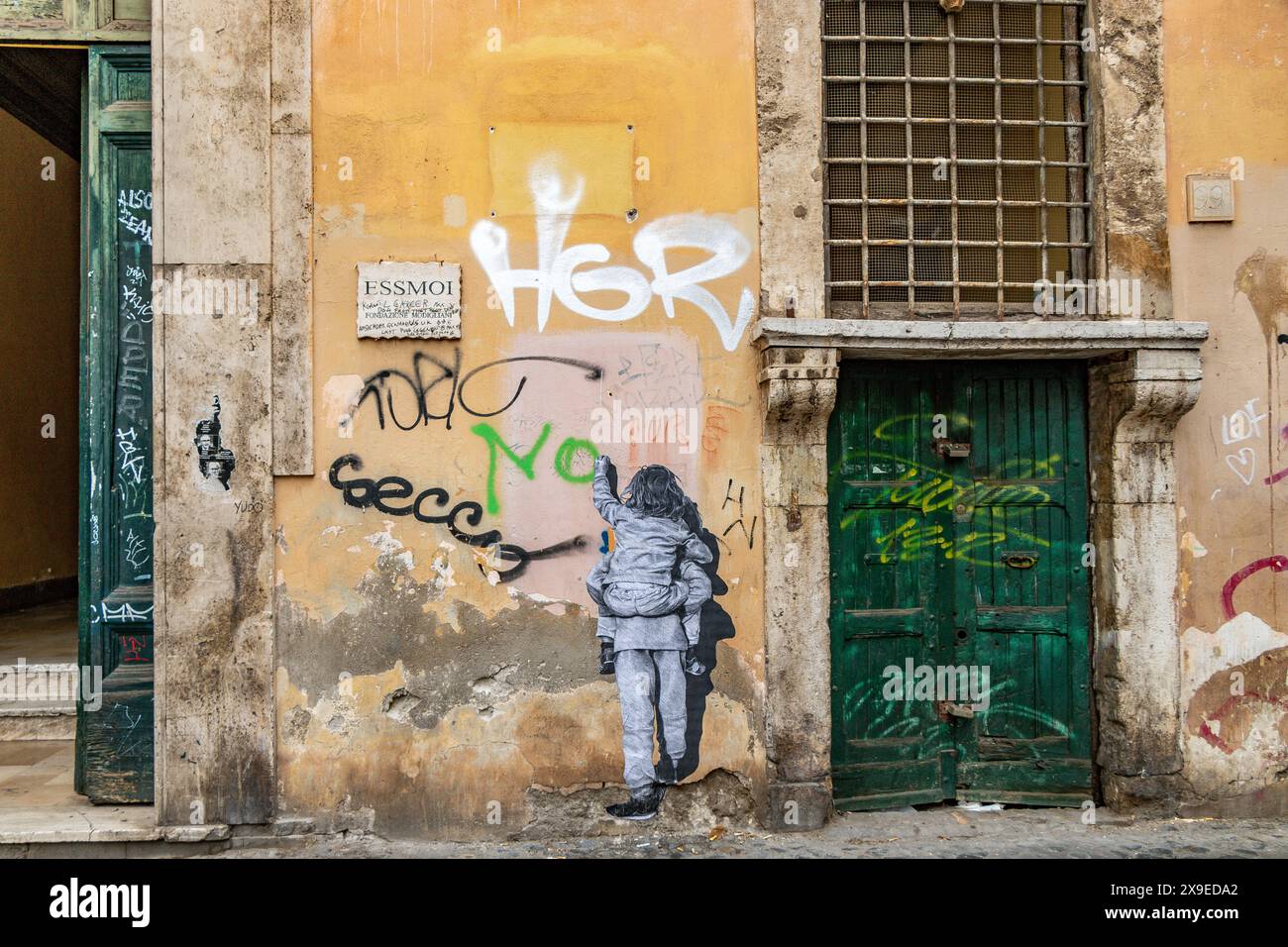 Street art su un muro nel quartiere Trastevere di Roma, Italia Foto Stock