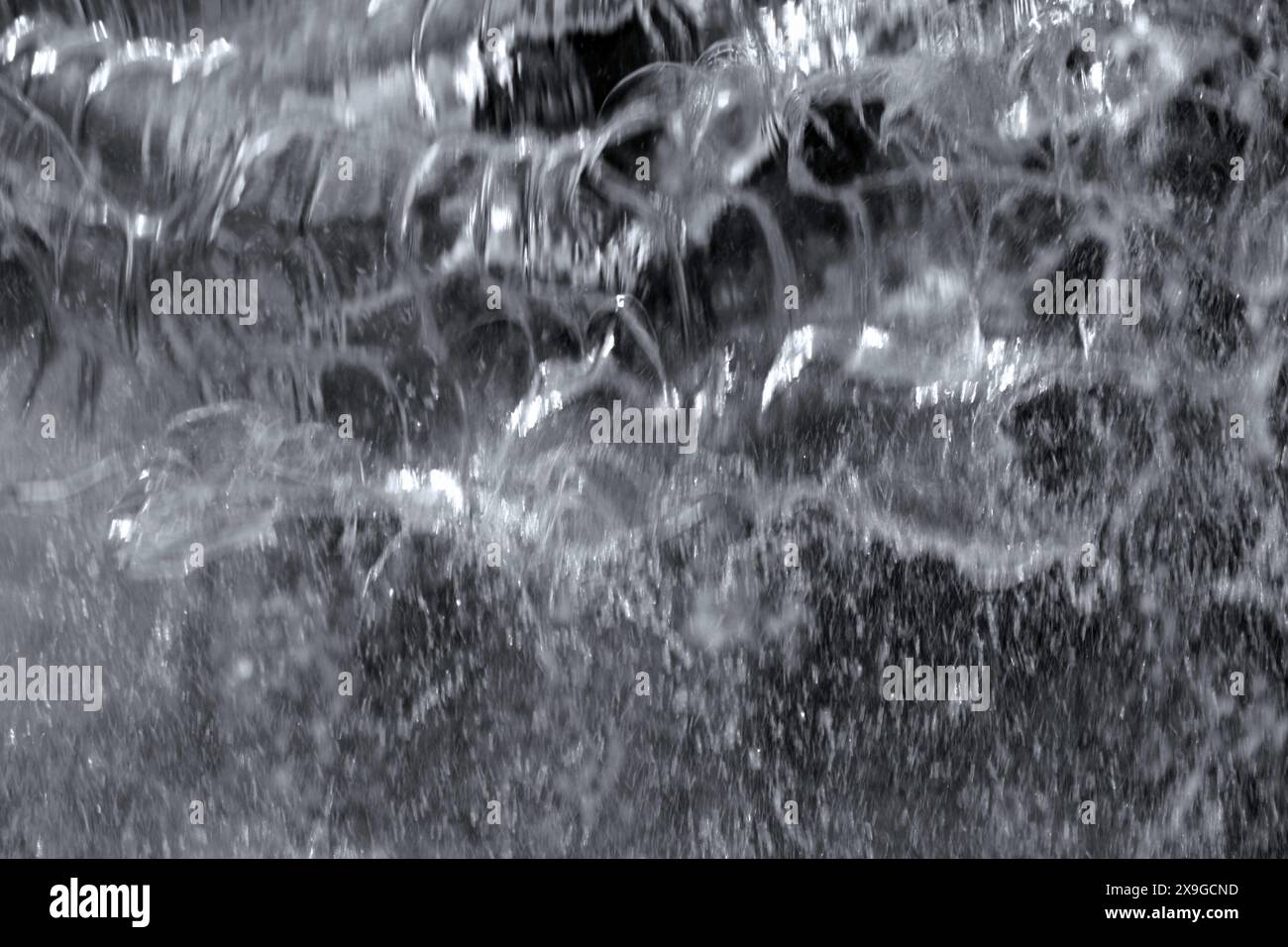 Foto del materiale di sfondo dell'acqua in caduta da vicino Foto Stock