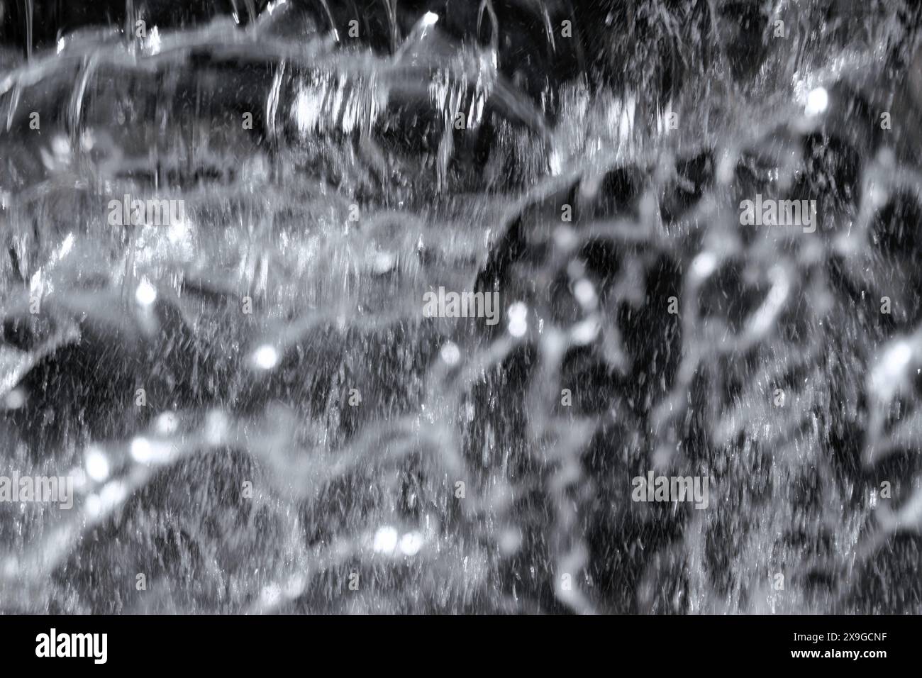 Foto del materiale di sfondo dell'acqua in caduta da vicino Foto Stock