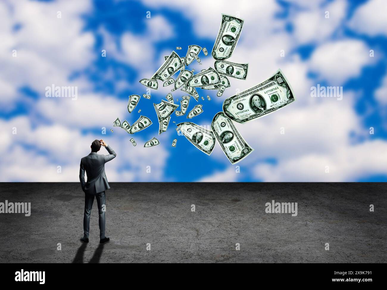 uomo d'affari che si grattava la testa e le banconote in dollari che volano Foto Stock