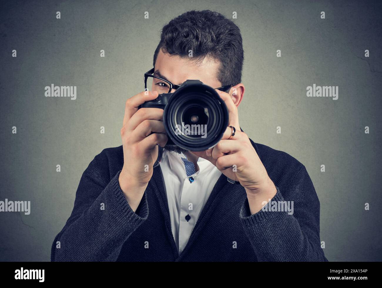 Fotografo con fotocamera digitale Foto Stock