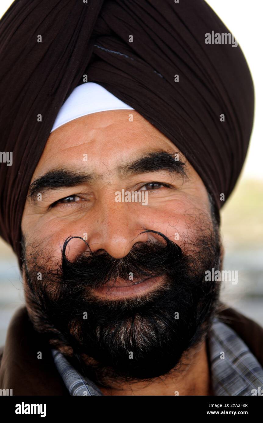Ritratto di un Sikh scattato ad Amritsar, India. Foto Stock
