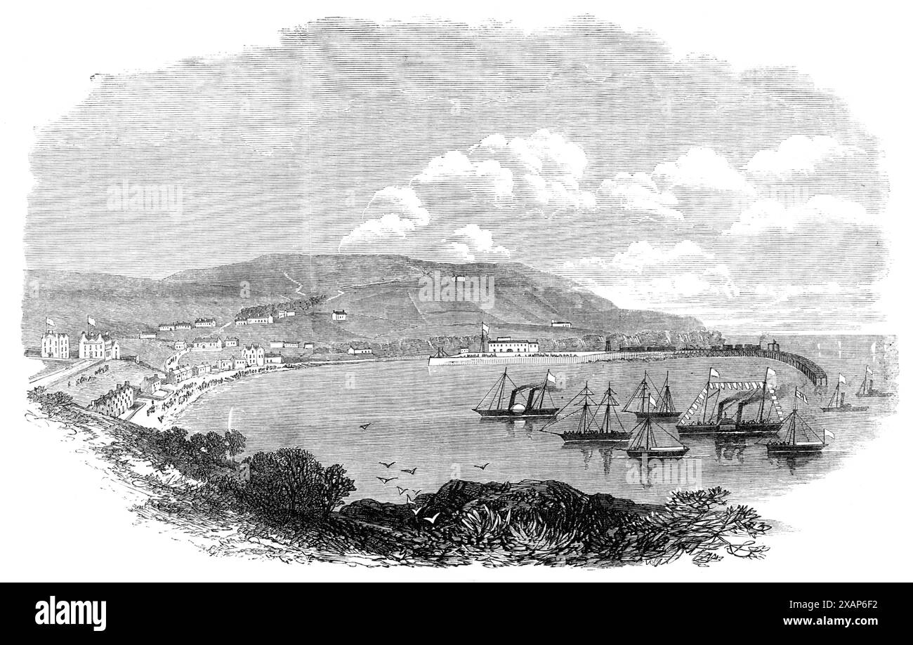 Visita del principe Artù all'Isola di Man: Port Erin, 1869. "La splendida baia di Port Erin... si trova sul lato ovest dell'isola di Tint, a circa tre miglia a nord del Calf of Man. È naturalmente protetta dai venti che soffiano da nord, sud e est, ma è esposta alle violente tempeste provenienti da ovest che infuriano nel Canale d'Irlanda durante i mesi invernali. Un frangiflutti è nuovo in corso di costruzione all'ingresso della baia che, una volta completato, renderà il porto di Port Erin il più sicuro e protetto sulla costa dell'Isola di Man. Questa frangiflutti è stata progettata dal signor Joh Foto Stock