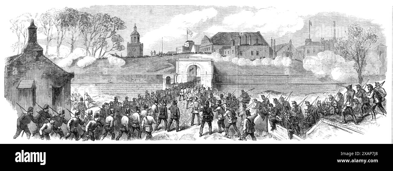 The Volunteer Review at Portsmouth: The Defending force concentrating at King William's Gate, 1869. Vista di una "lotta finta” - esercitazioni militari da parte dei soldati britannici. Il nemico allora, unendo tutta la sua forza, si preparò ad assaltare la fortezza, e l'ha attaccato per tutta la lunghezza delle sue difese, la sua flotta raddoppiando il fuoco sulla faccia marina delle difese... tutti impegnati - sia le truppe regolari che i volontari - sembravano entrare nel lavoro pomeridiano davanti a loro nel miglior spirito possibile". Da "Illustrated London News", 1869. Foto Stock