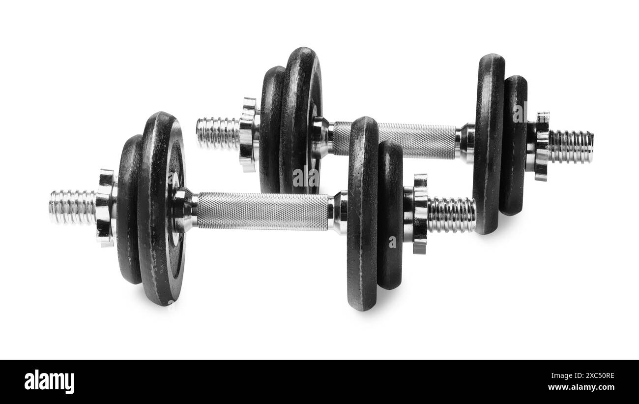 Manubri in metallo isolati su bianco. Attrezzature sportive Foto Stock