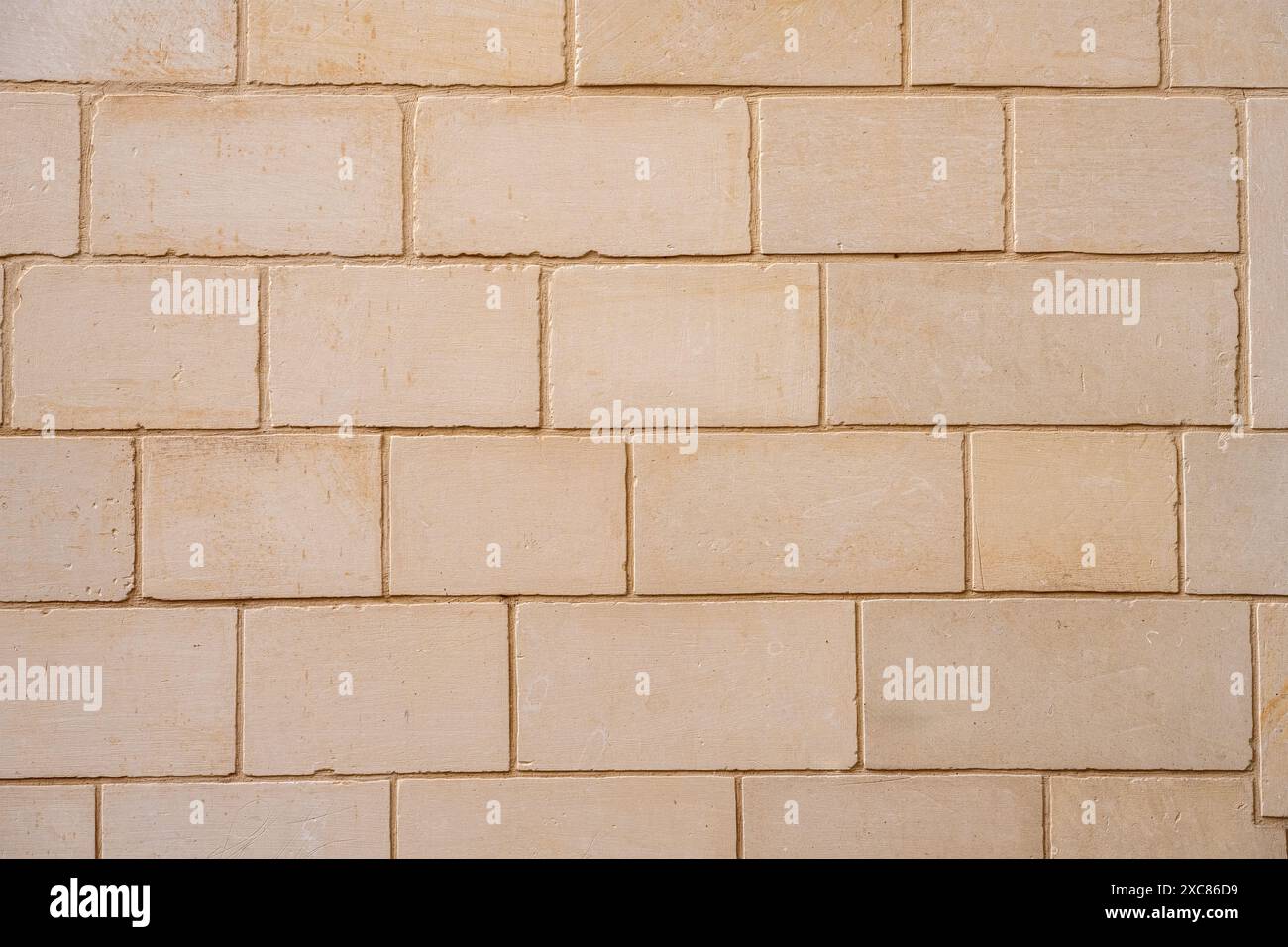Sfondo di un muro fatto di grandi blocchi di mattoni Foto Stock