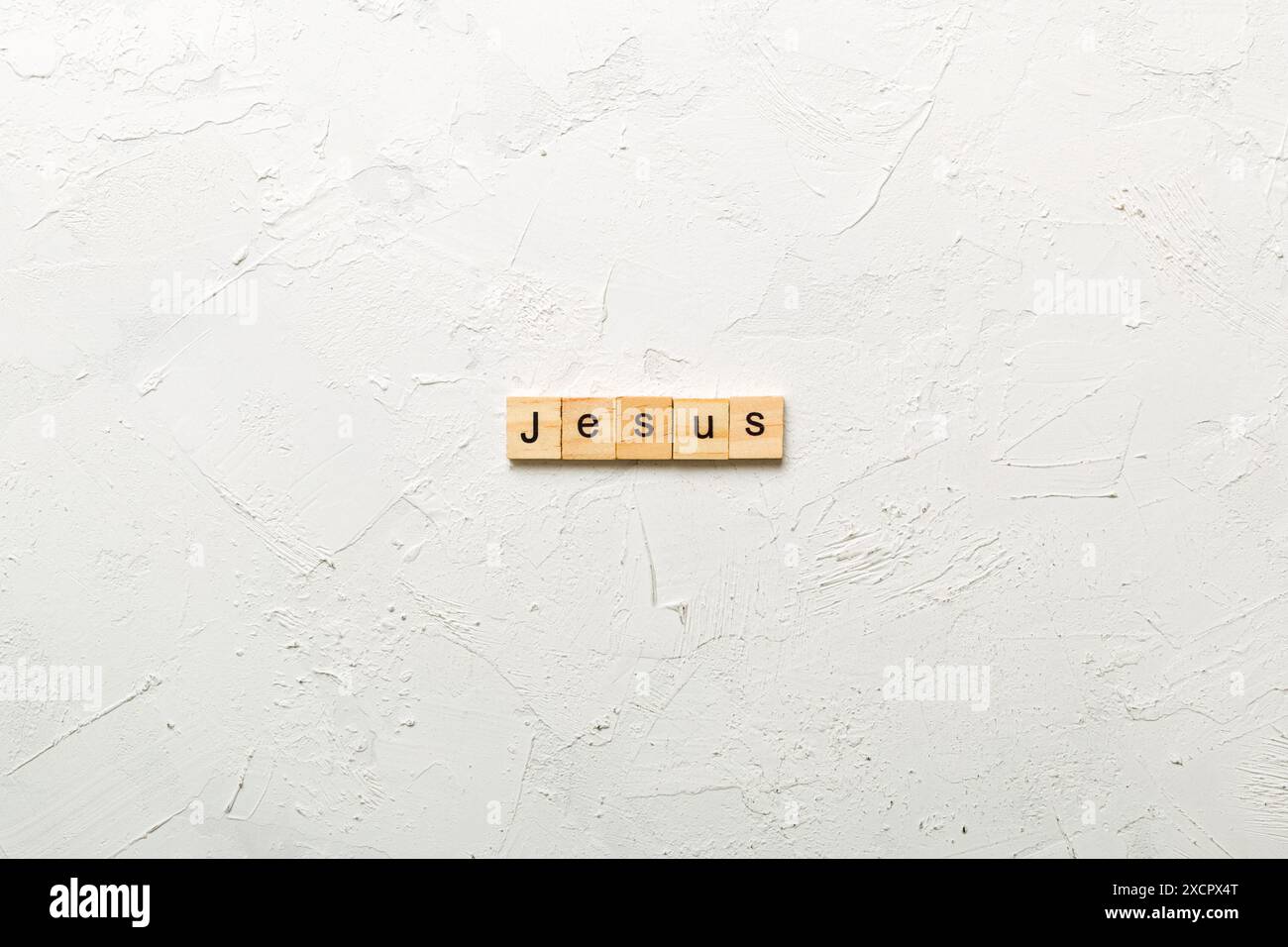Gesù parola scritta sul blocco di legno. Gesù testo sul tavolo, concetto. Foto Stock