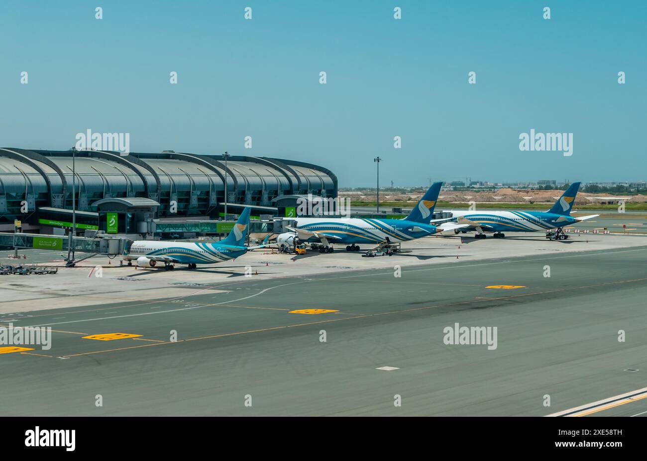 Muscat, Oman - 9 maggio 2024 - Oman Air Planes presso l'aeroporto internazionale di Muscat (MCT) Foto Stock