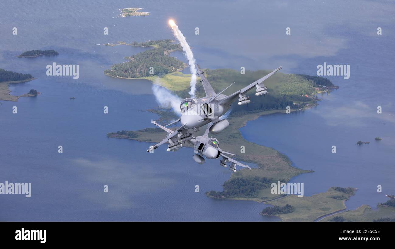 SAAB JAS 39C Gripen - 214 e 226 dell'aeronautica militare svedese Break and Realse Fllares - Air-to-Air Photography Foto Stock