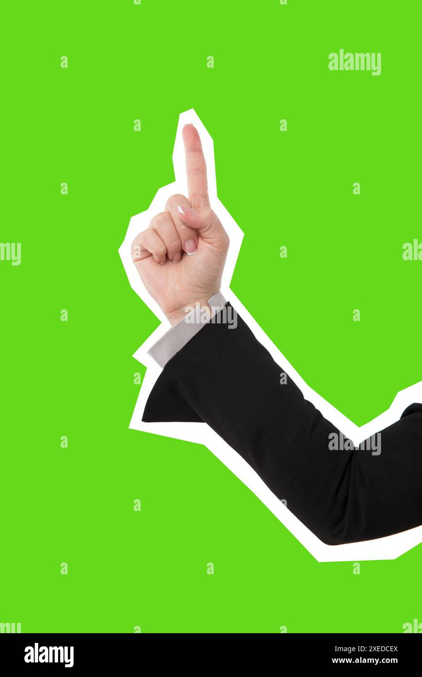 Mano femminile di donna di affari che punta al copyspace, stile isolato della rivista Foto Stock