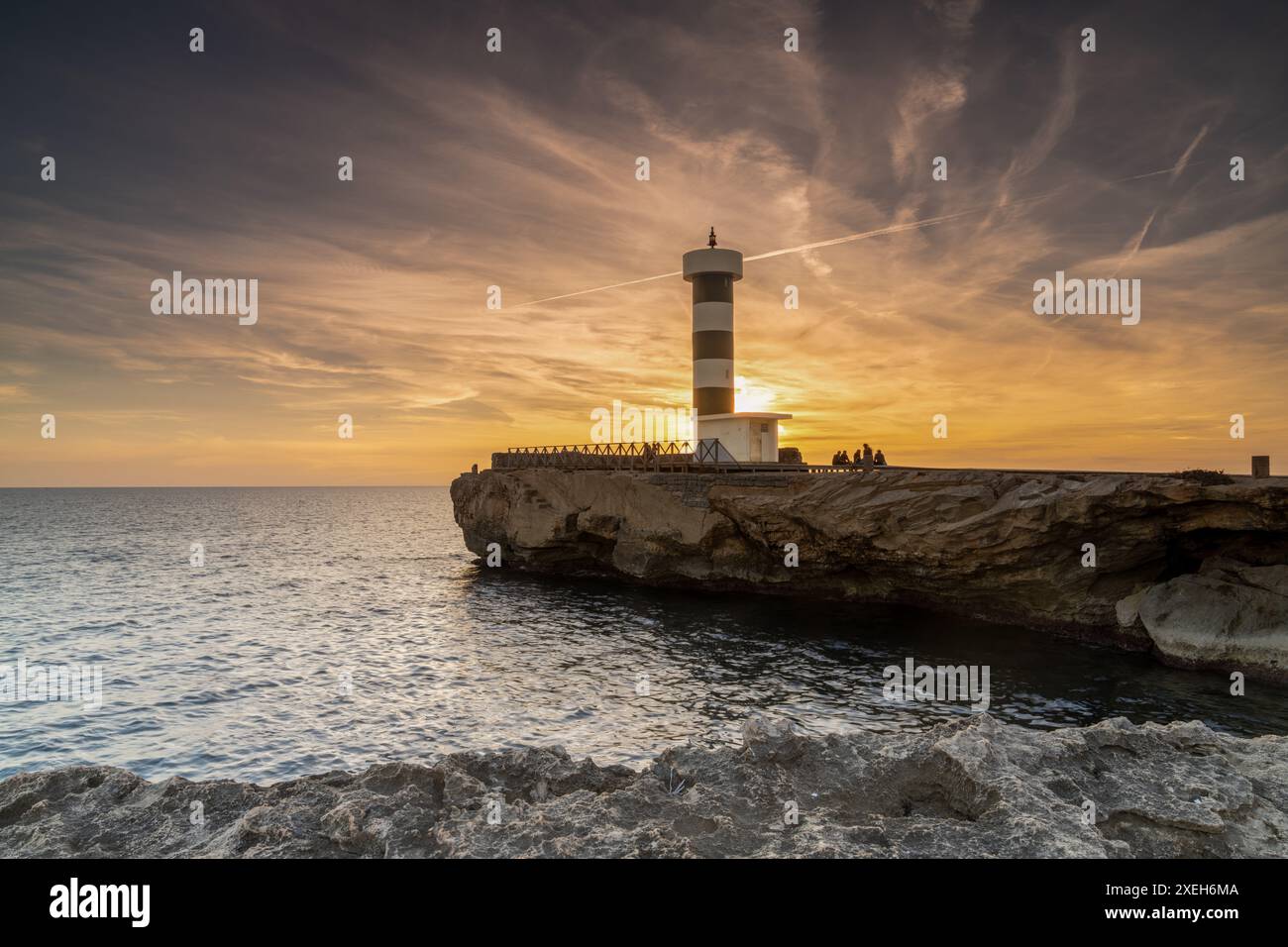 Vista del faro di Colonia Sant Jordi a Maiorca al tramonto Foto Stock