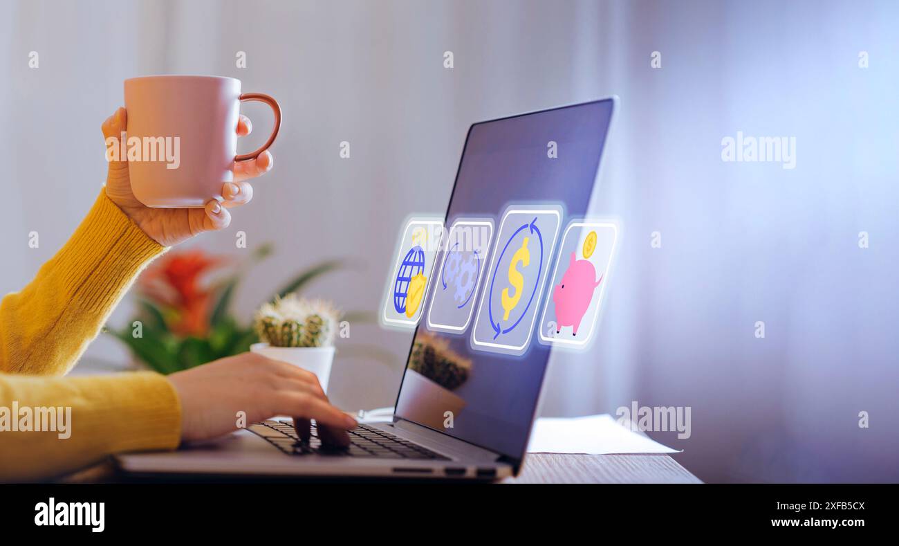 Primo piano di una persona che analizza i dati finanziari su un notebook mentre tiene in mano una tazza da caffè. Sullo schermo vengono visualizzate varie icone finanziarie, che rappresentano il livello globale Foto Stock