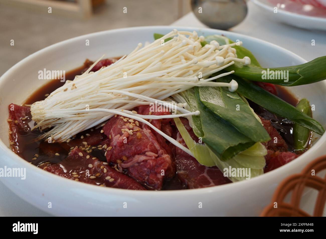 Il bulgogi è un famoso piatto di carne coreana Foto Stock