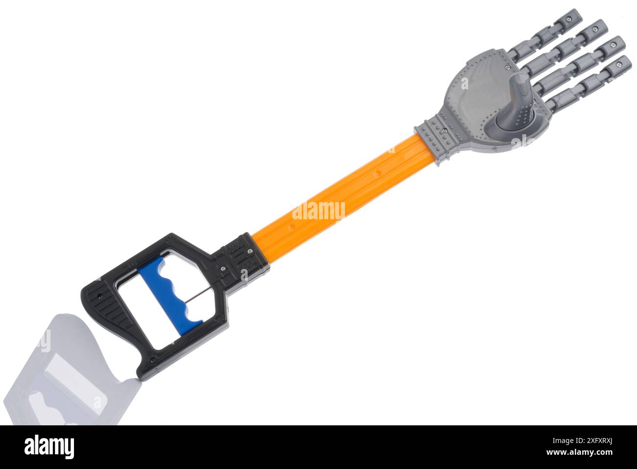 Mano di aiuto, braccio robotico, giocattolo, grattacielo posteriore, reacher, afferrare o artiglio! Foto Stock